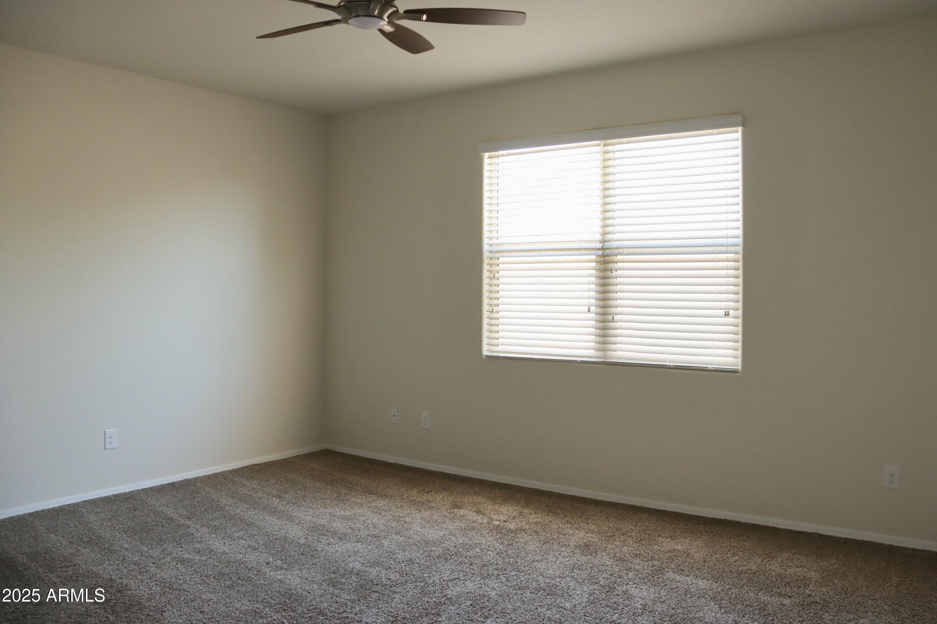4734 East Pearl Road San Tan Valley, AZ 85143 - Photo 23 of 27 an empty room with a window