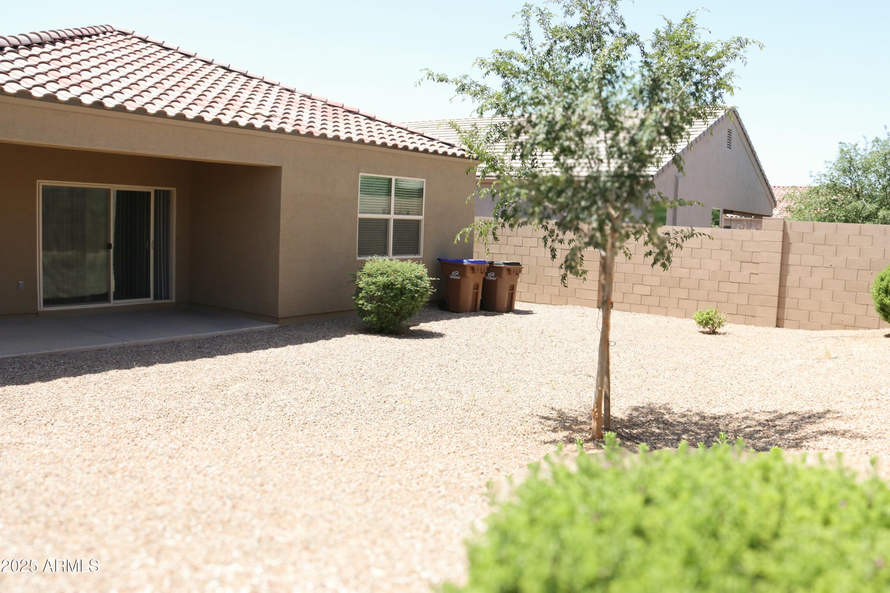 4734 East Pearl Road San Tan Valley, AZ 85143 - Photo 25 of 27 a front view of a house with a yard