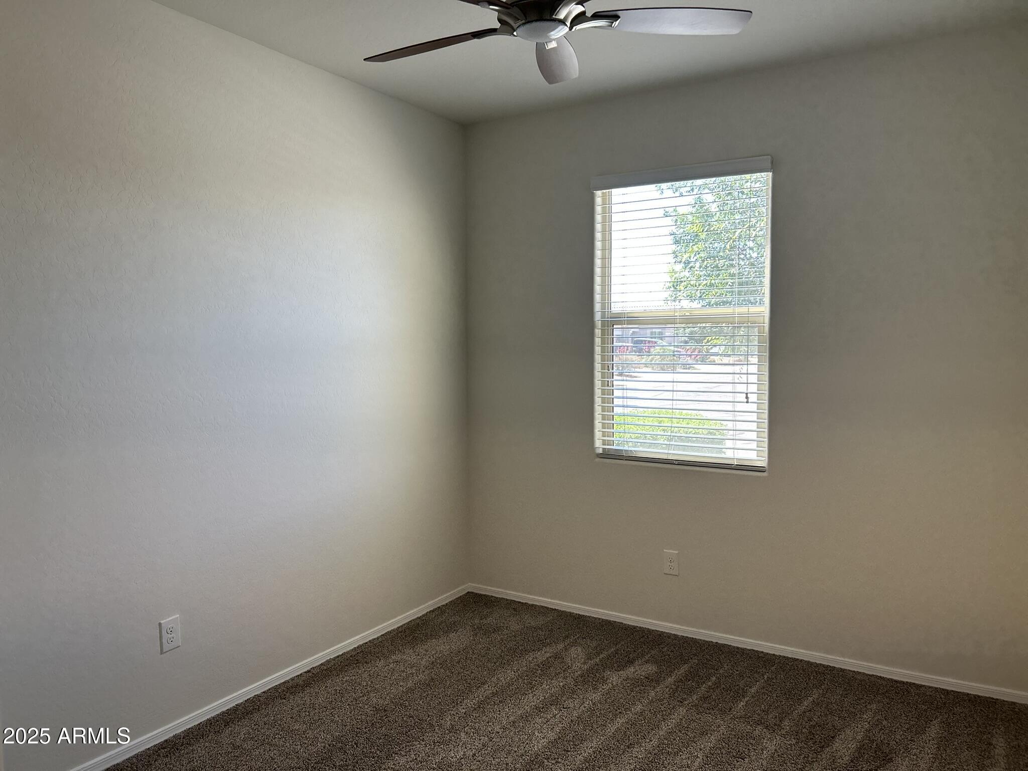 4734 East Pearl Road San Tan Valley, AZ 85143 - Photo 3 of 27 an empty room with a window