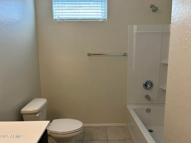 a bathroom with a sink a toilet and bathtub