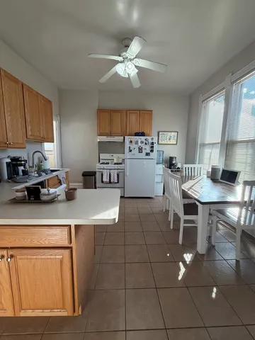 a kitchen with a sink cabinets and window