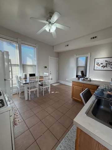 a kitchen with a sink and a stove top oven