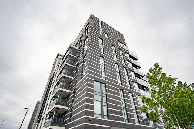 a view of wooden floor with two sitting in it