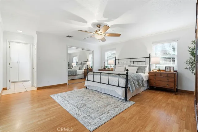 a bedroom with a bed and a dresser in it