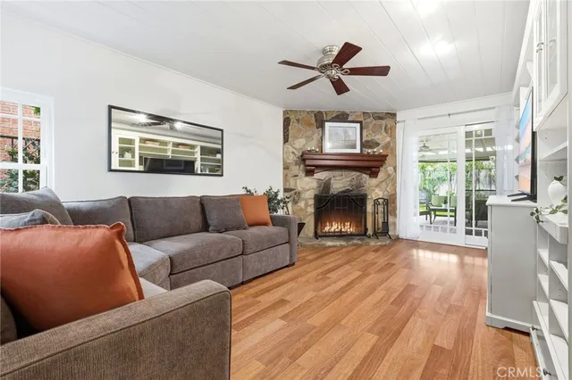 a living room with furniture fireplace and flat screen tv
