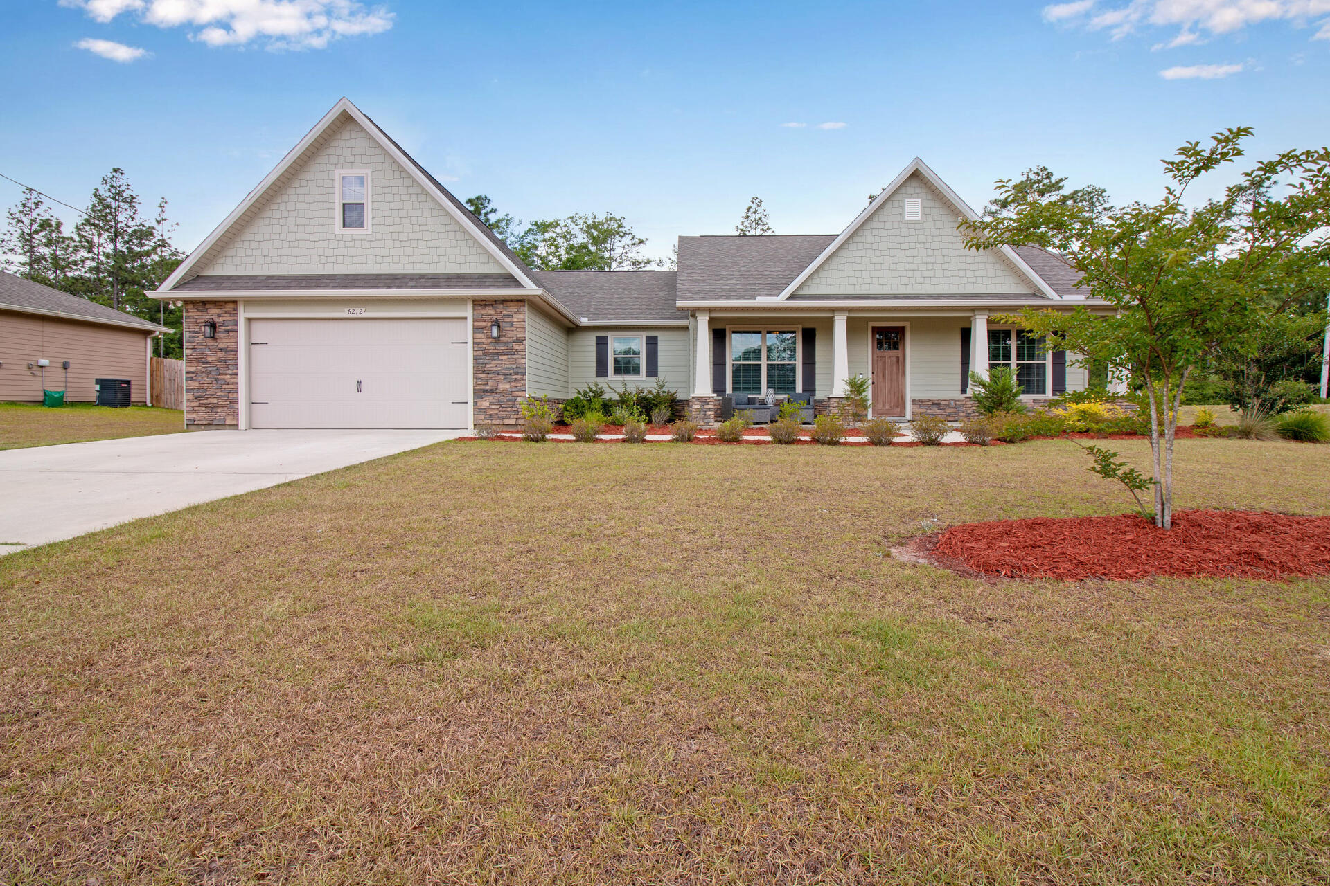 6212 Timberland Ridge Drive Crestview, FL 32539 - Photo 1 of 34 a front view of a house with yard