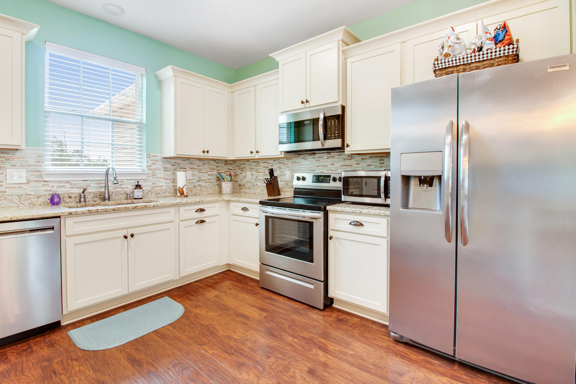 6212 Timberland Ridge Drive Crestview, FL 32539 - Photo 11 of 34 a kitchen with stainless steel appliances a refrigerator sink and microwave
