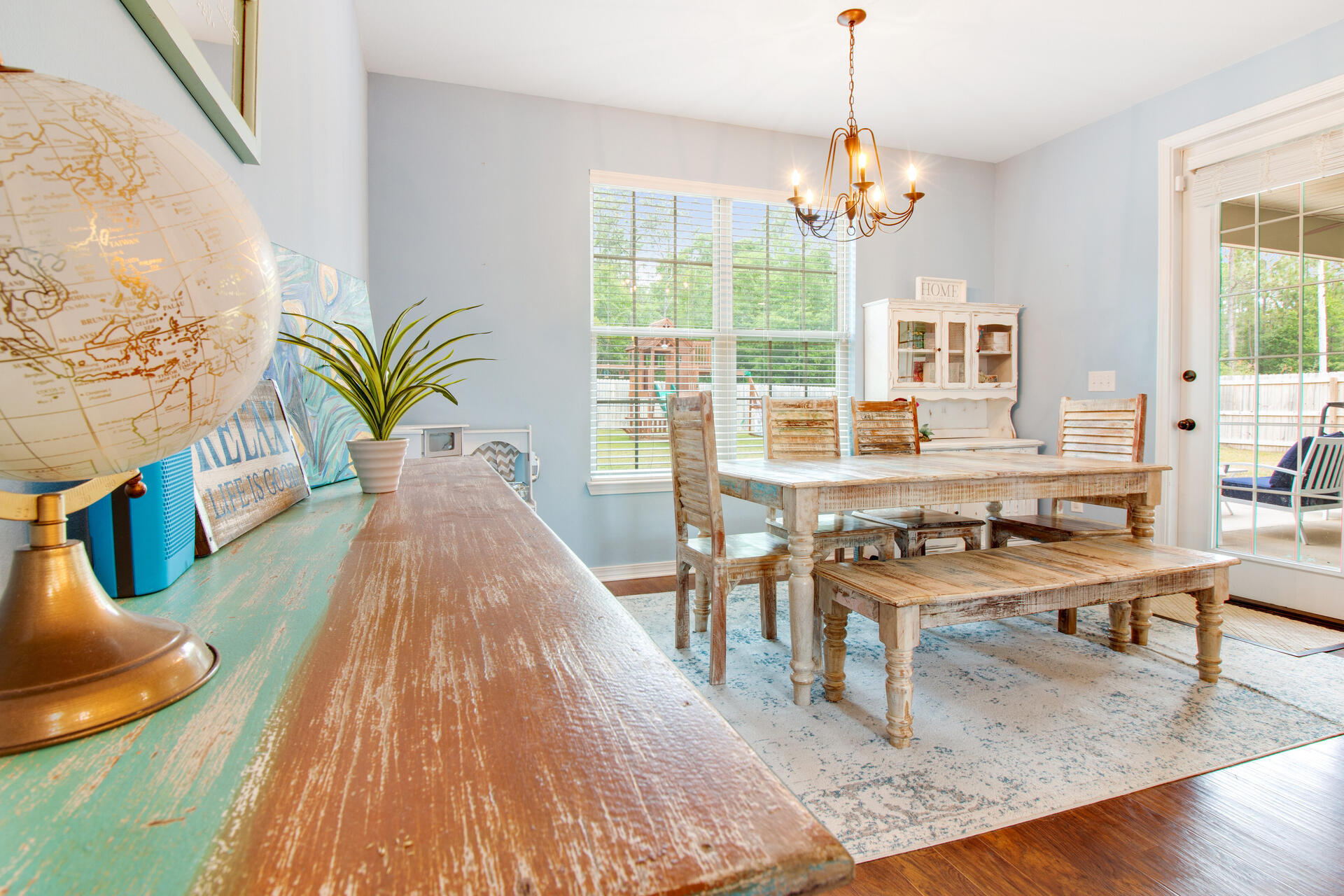 6212 Timberland Ridge Drive Crestview, FL 32539 - Photo 13 of 34 a dining room with furniture a chandelier and wooden floor