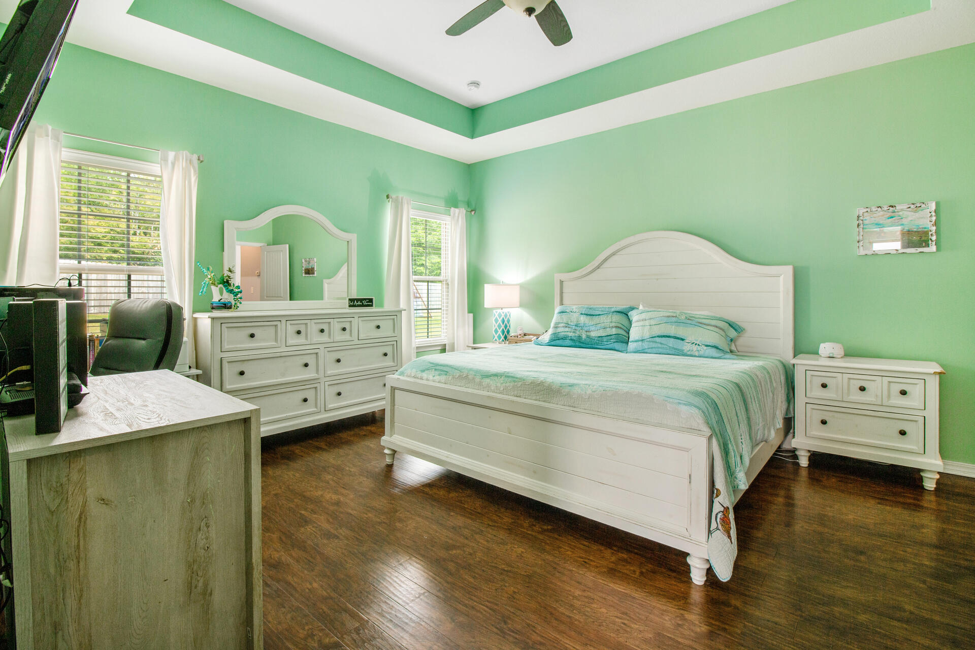 6212 Timberland Ridge Drive Crestview, FL 32539 - Photo 16 of 34 a bedroom with a bed and a chandelier