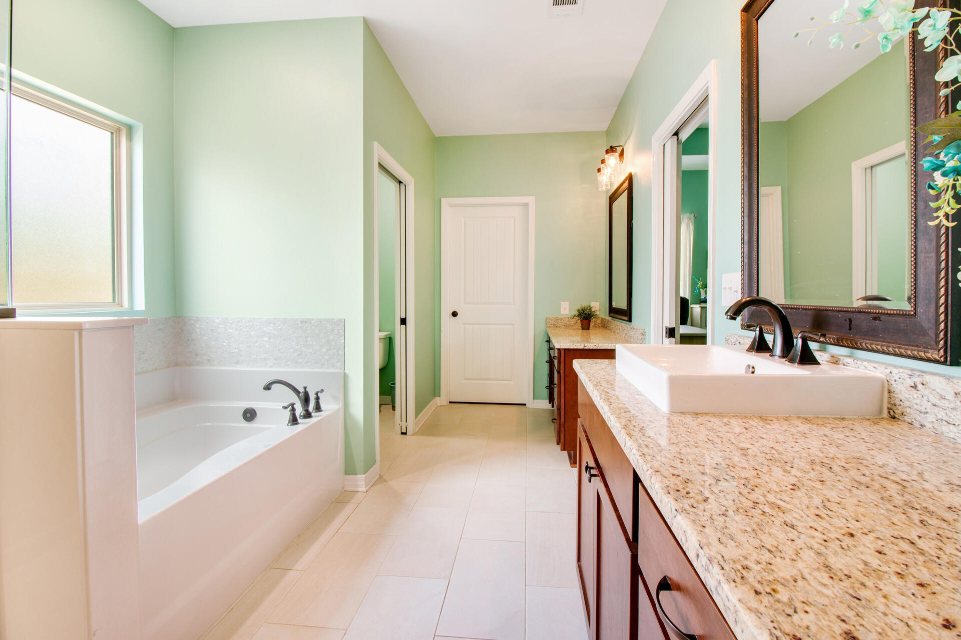 6212 Timberland Ridge Drive Crestview, FL 32539 - Photo 18 of 34 a spacious bathroom with sink bathtub and mirror