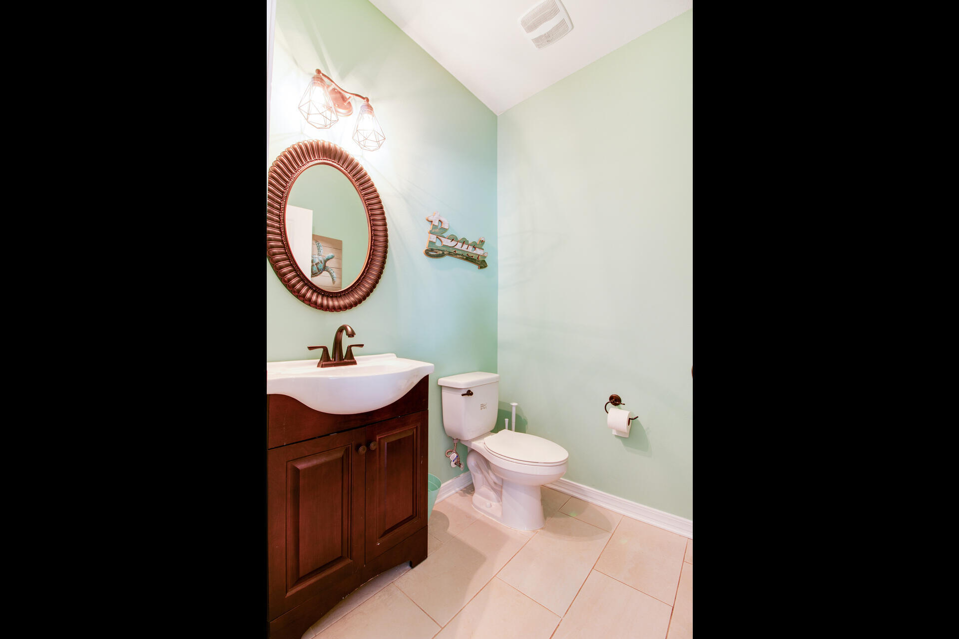 6212 Timberland Ridge Drive Crestview, FL 32539 - Photo 20 of 34 a bathroom with a sink a toilet and a mirror