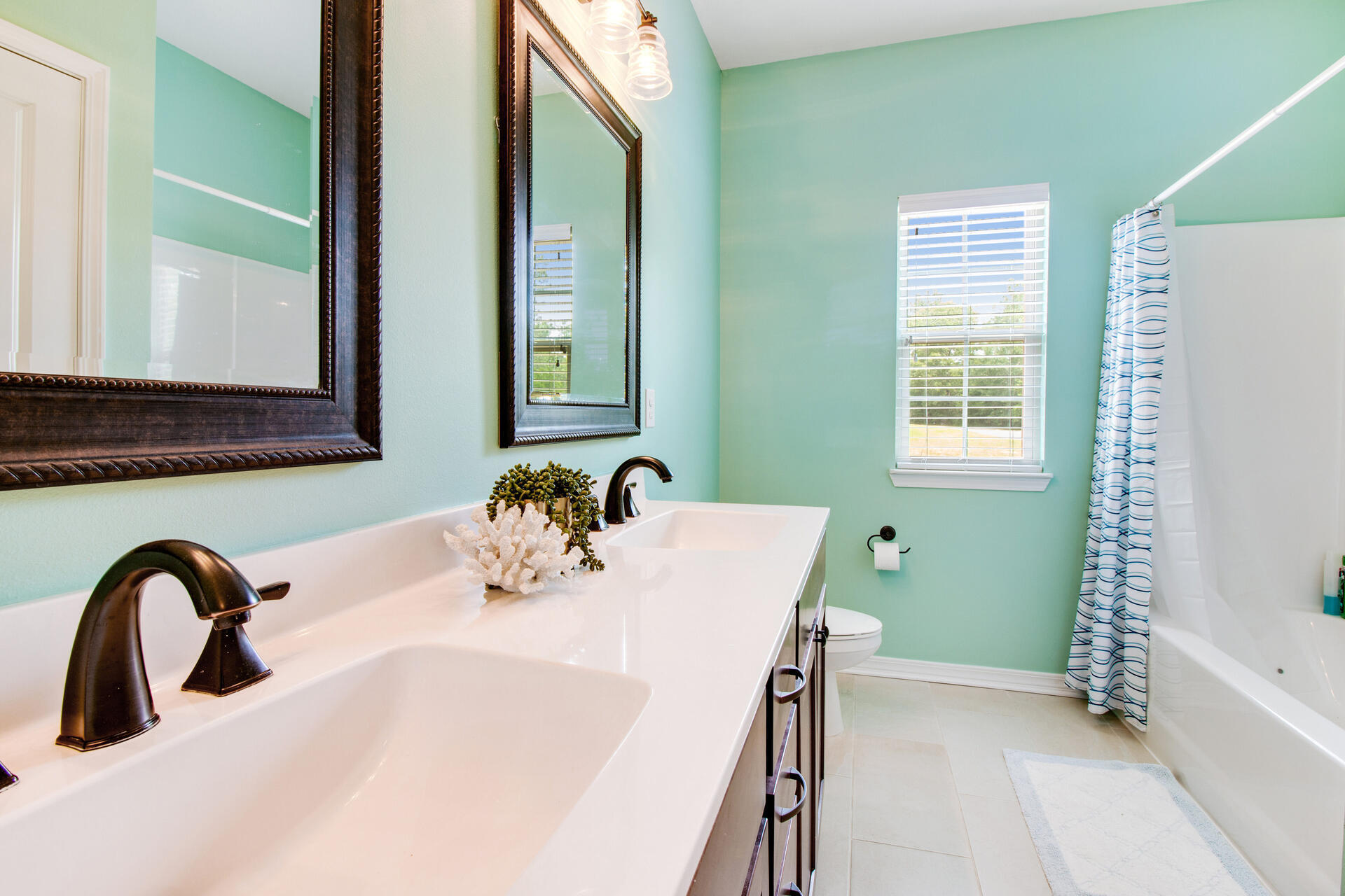 6212 Timberland Ridge Drive Crestview, FL 32539 - Photo 24 of 34 a bathroom with a sink and a mirror