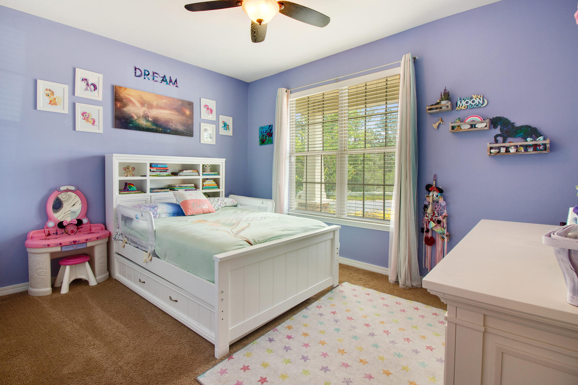 6212 Timberland Ridge Drive Crestview, FL 32539 - Photo 25 of 34 a bedroom with a bed and a chandelier