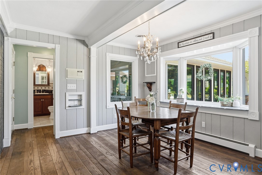 13300 West Patrick Henry Road Doswell, VA 23047 - Photo 15 of 69 Dining area featuring wood-finish flooring, a bay