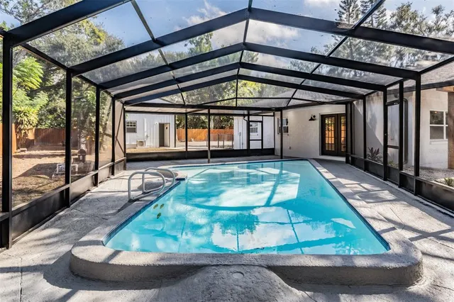 a view of a patio with table and chairs