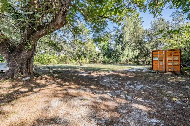 a view of outdoor space with deck and tree