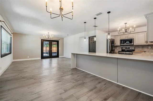 a view of a kitchen with a sink and microwave