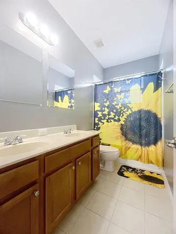 a bathroom with a sink mirror and a bathtub