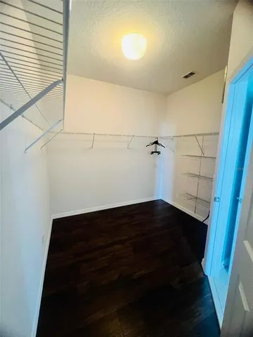 a view of room with hardwood floor and window