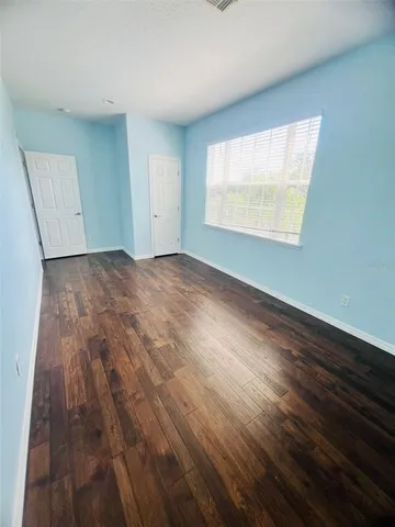 a view of entryway with wooden floor and stairs