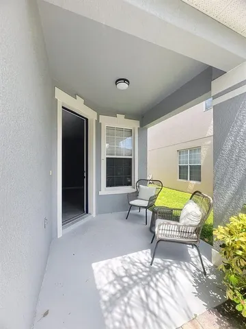 a living room with furniture and a window