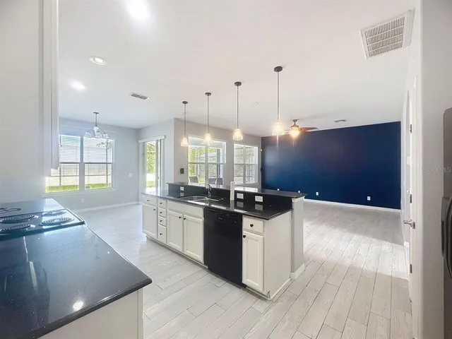 a large kitchen with lots of counter space and appliances