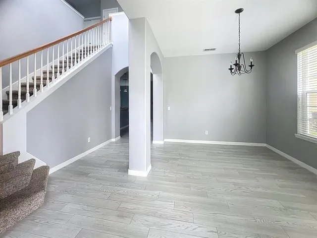 a view of an entryway with wooden floor