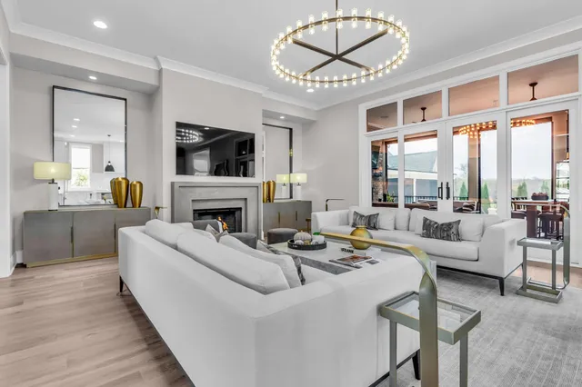 a living room with fireplace furniture and a flat screen tv