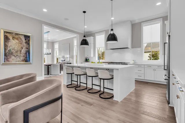 a spacious bathroom with a granite countertop sink a mirror and a