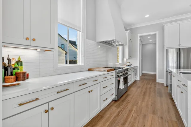 a kitchen with stainless steel appliances granite countertop a sink and a cabinets