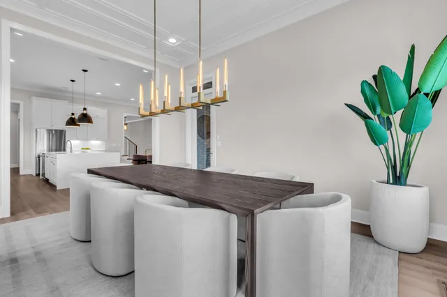 a bedroom with a bed a couch and a flat screen tv