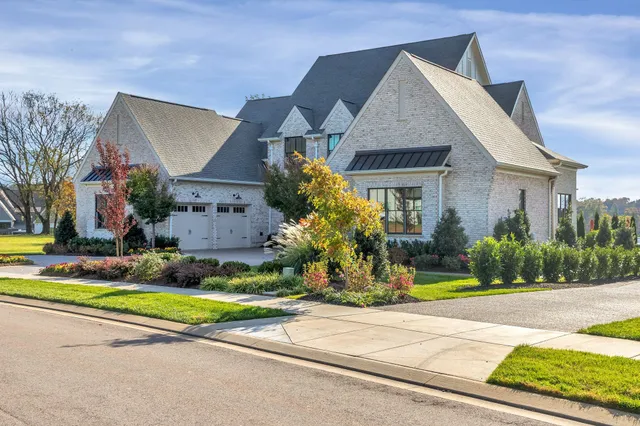 a front view of house with garden