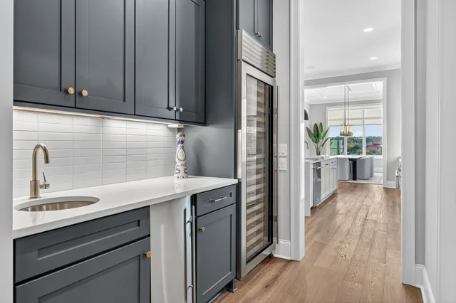 a view of a roof deck with couches and sky view