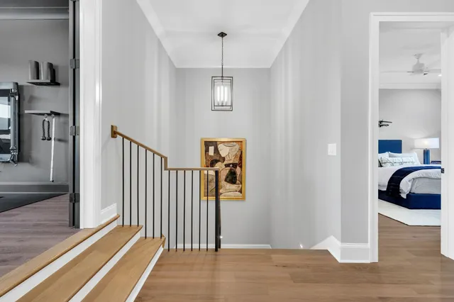 a living room with furniture a flat screen tv and kitchen view