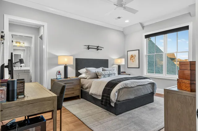 a living room with furniture and a book shelf