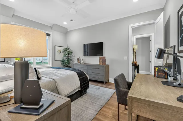 a living room filled with furniture and a floor to ceiling window