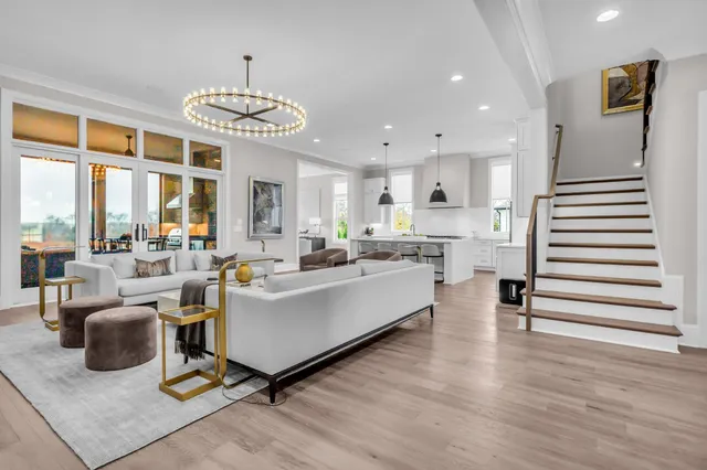 a living room with fireplace furniture and a flat screen tv