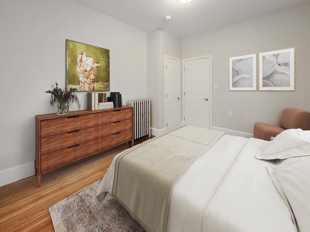 108 Callender Street, Unit 1 Boston, MA 02124 - Photo 5 of 9 a bedroom with a bed and a dresser