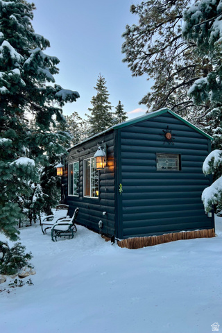 140 East Rim Road Duck Creek Village, UT 84762 - Photo 9 of 45 Snow covered property with log veneer siding
