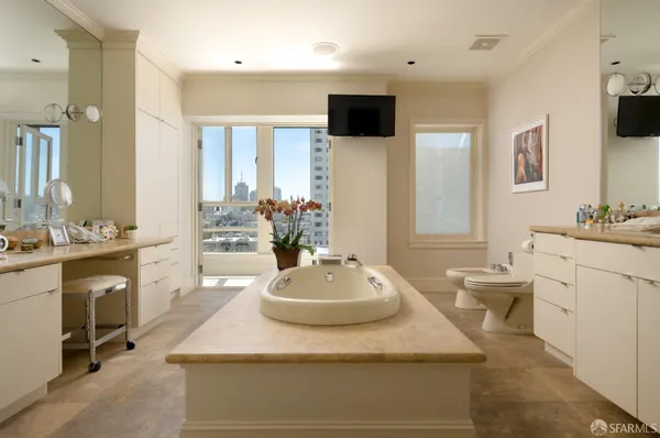 a bathroom with a sink a mirror and a bathtub