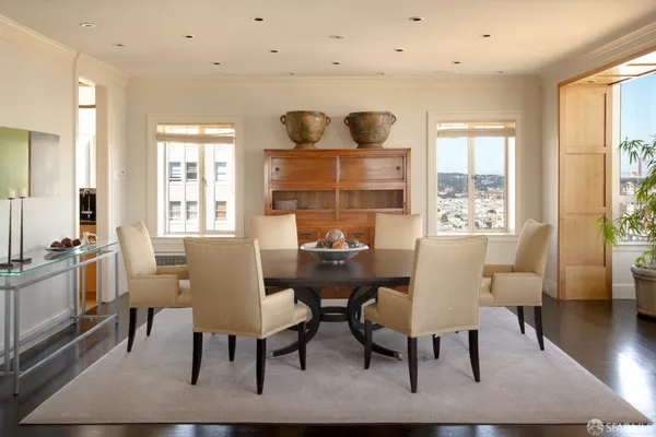 a view of a dining room with furniture window and wooden floor