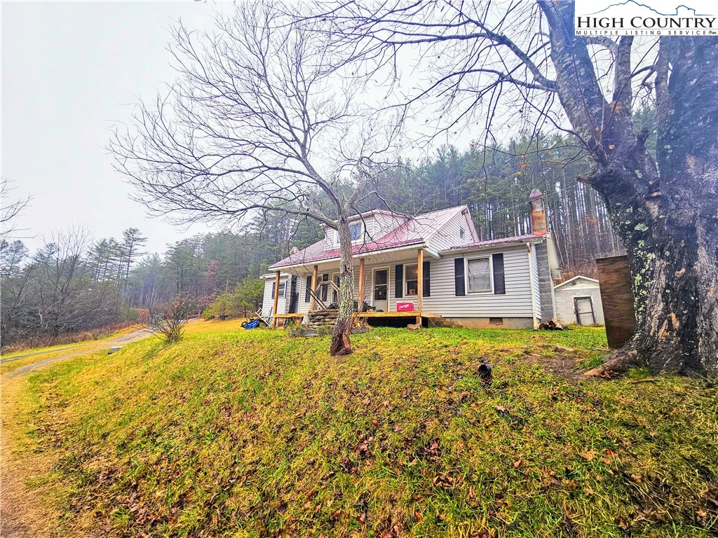 a house with swimming pool in front of it