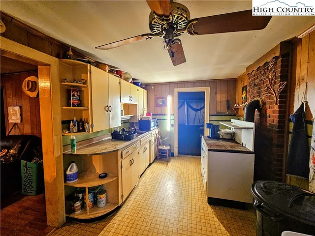 a kitchen with stainless steel appliances granite countertop a sink and cabinets