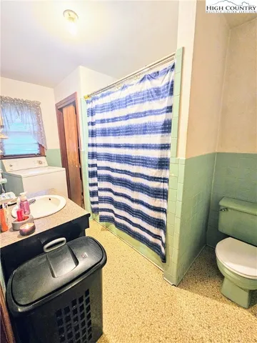 a very nice looking room with many windows and furniture