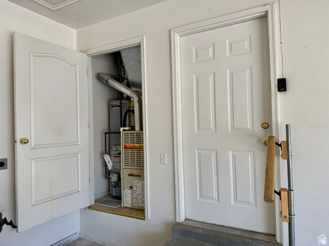 461 Topaz Boulevard, Unit 6 Delta, UT 84624 - Photo 42 of 45 Utility closet with a visible water heater and furnace in the garage