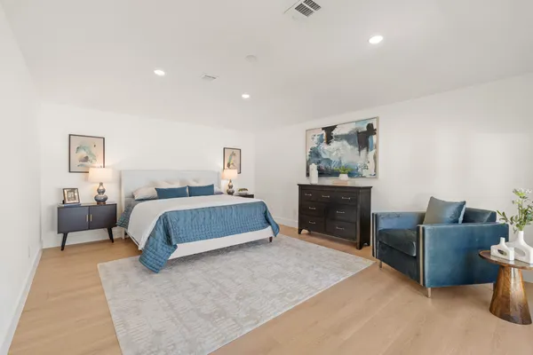 a bedroom with furniture and window