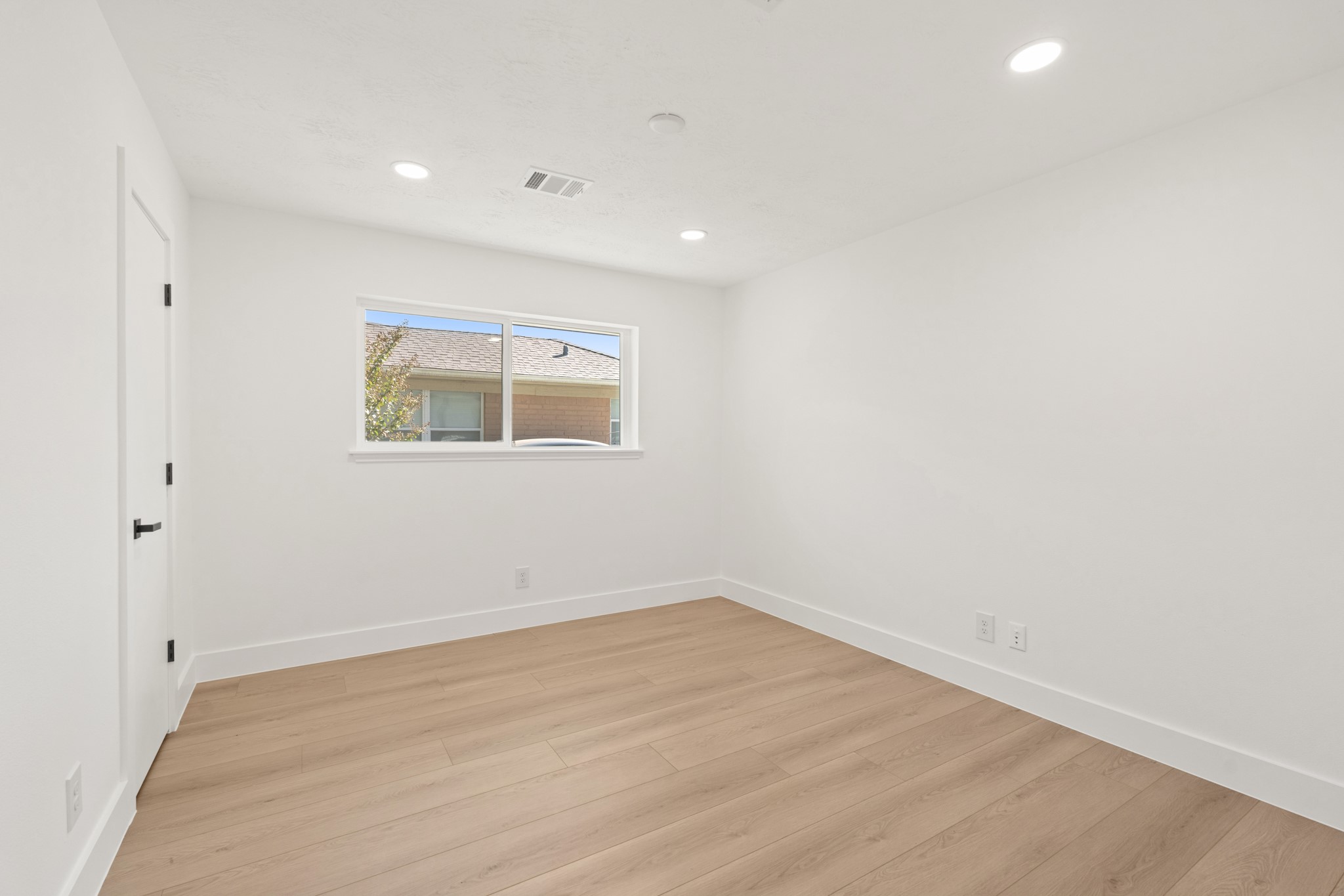 7631 Westwind Lane Houston, TX 77071 - Photo 15 of 21 a view of a room with wooden floor and window