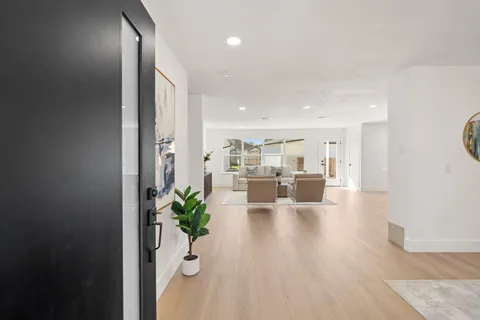 a view of a living room and kitchen with furniture