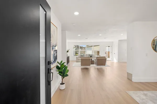 a view of a living room and kitchen with furniture