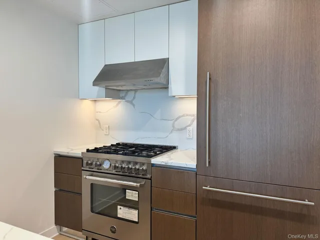 a kitchen with a stove and a microwave